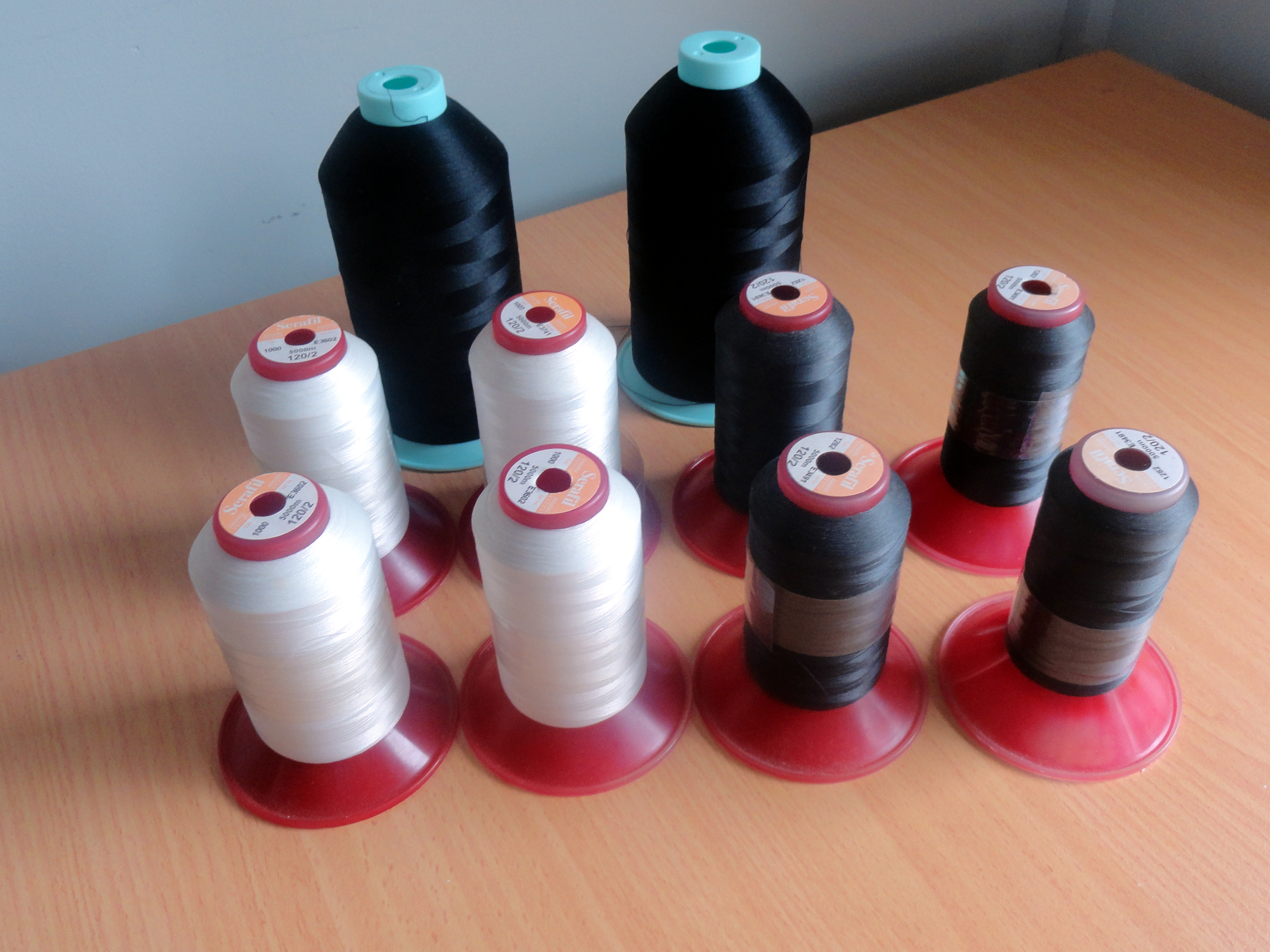 Overlocker Thread Spools - 4 Off-White Serafil, 4 Charcoal Serafil, 2 Black Woolly Nylon