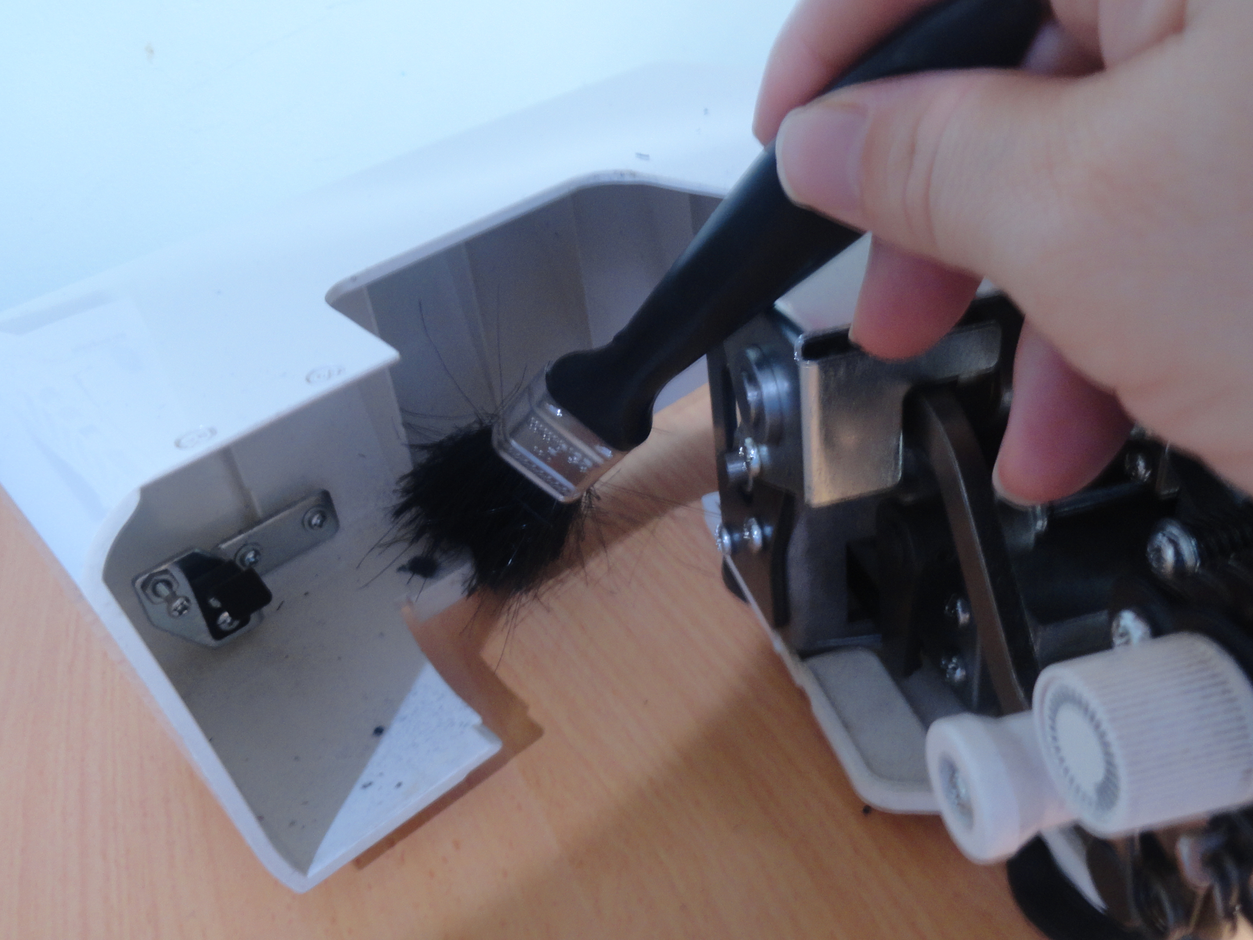 Cleaning inside side cover of Janome MyLock 644D Overlocker
