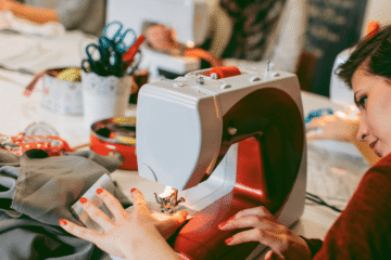 Group of women working on sewing machines.